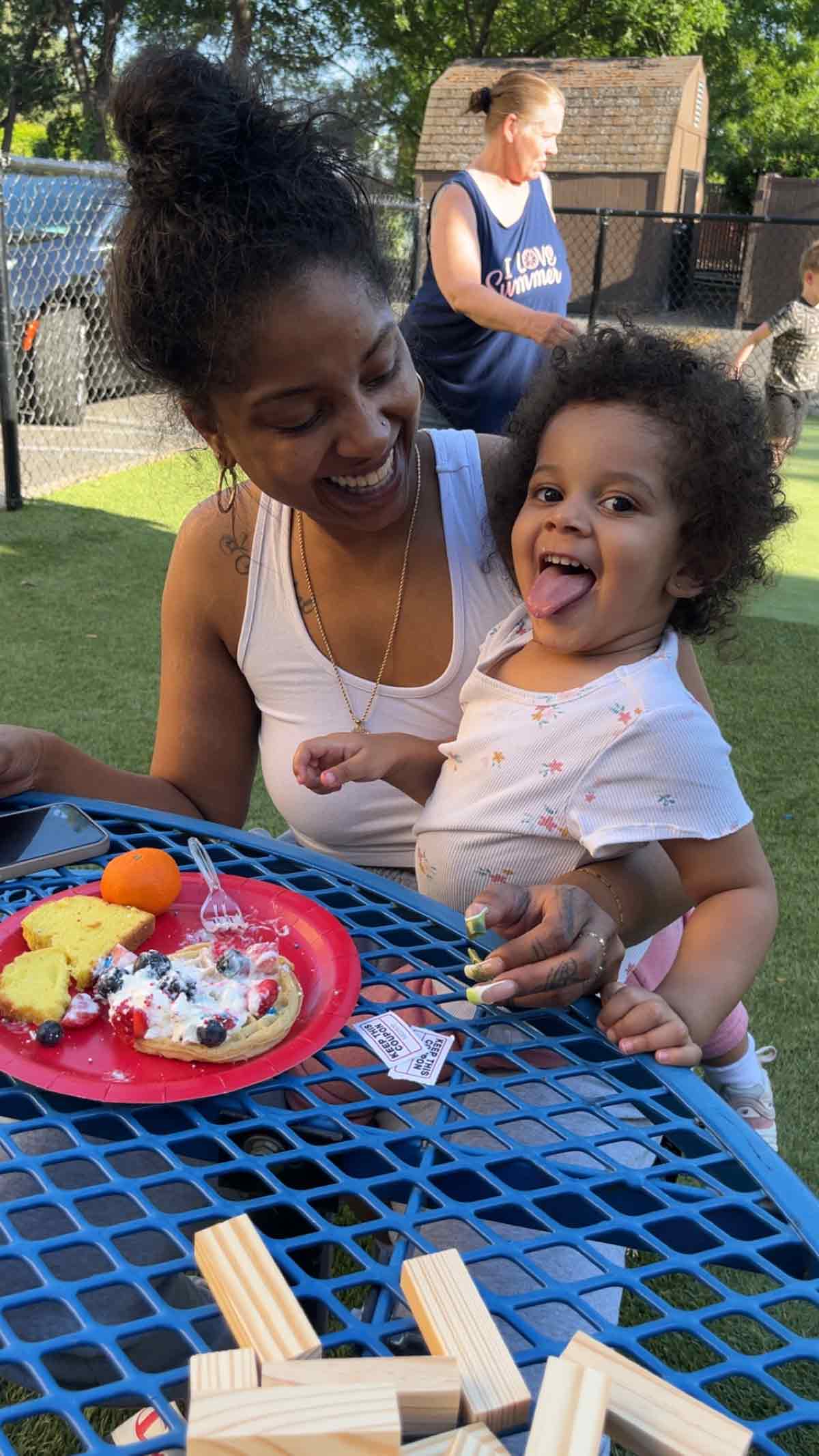 Woman and child enjoying food